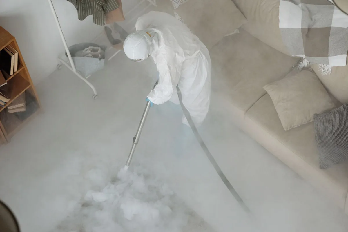 Biohazard cleanup technician in protective equipment, Louisville, GA